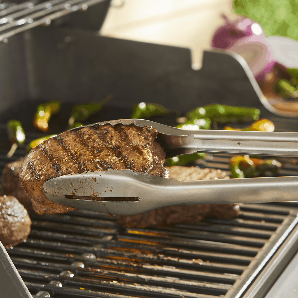Weber Precision Grill Tongs in use