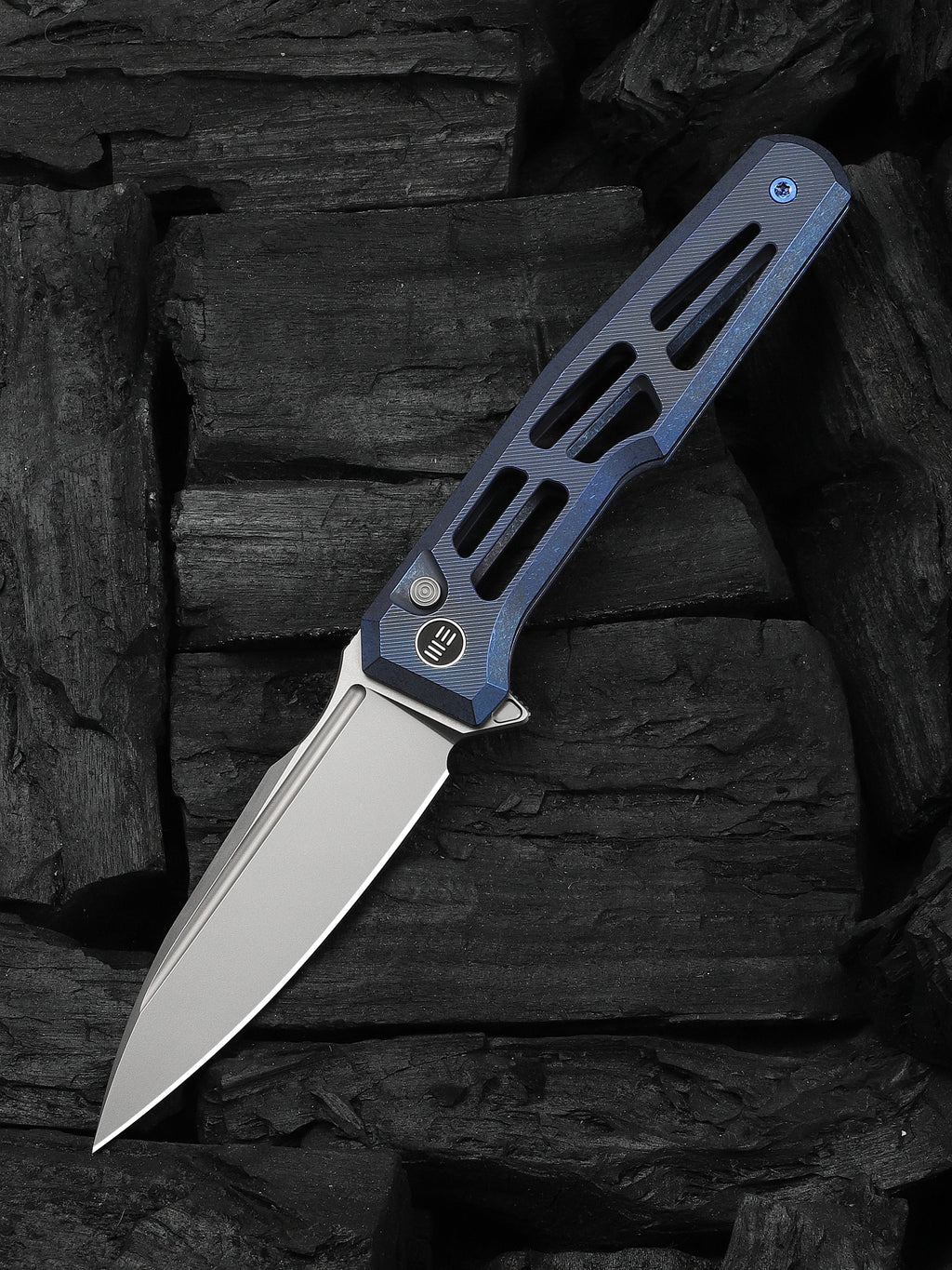 WE Knife Co Dressytak folding knife with skeletonized blue titanium handle