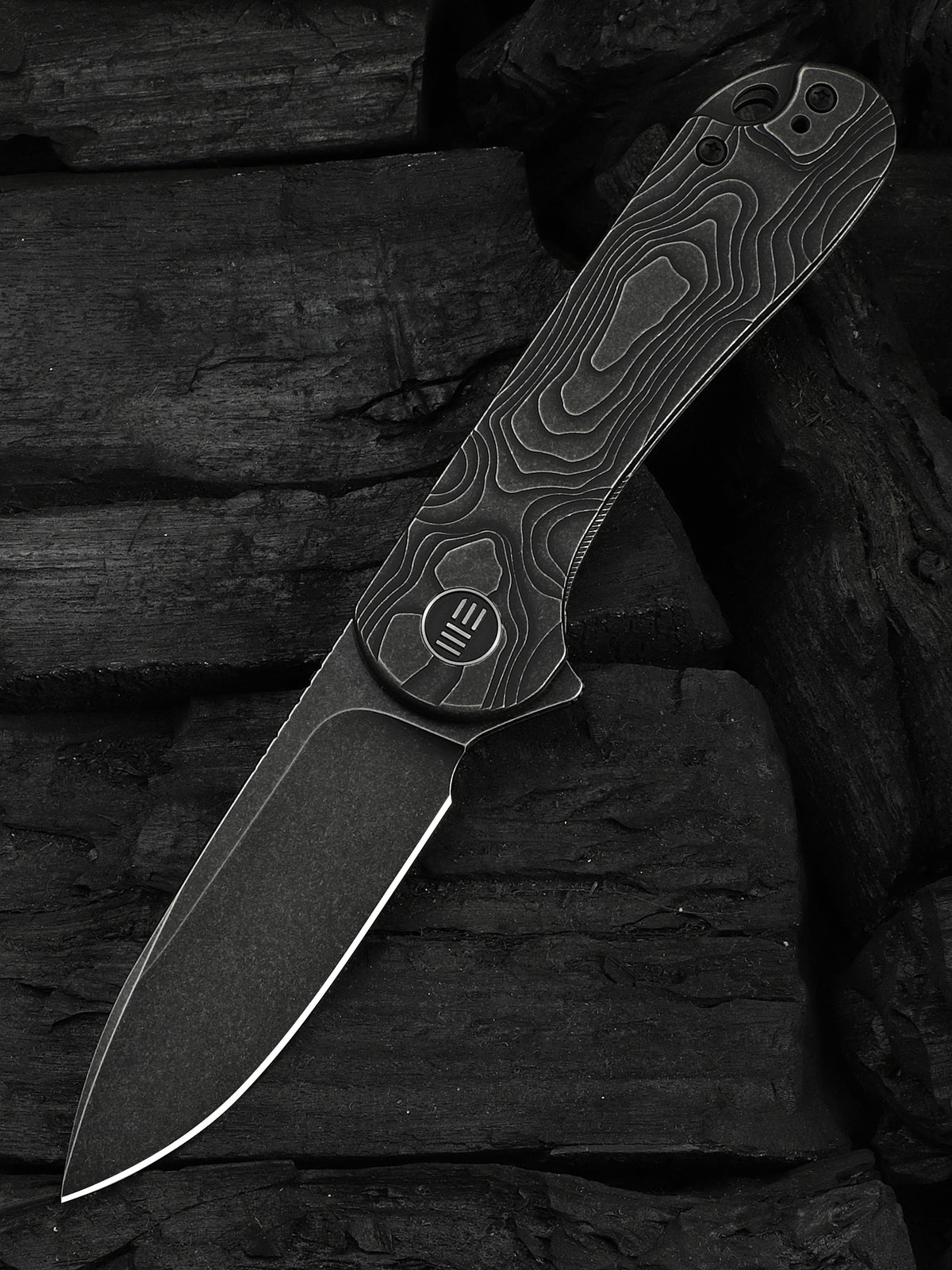 WE Elementum folding knife with black titanium handle