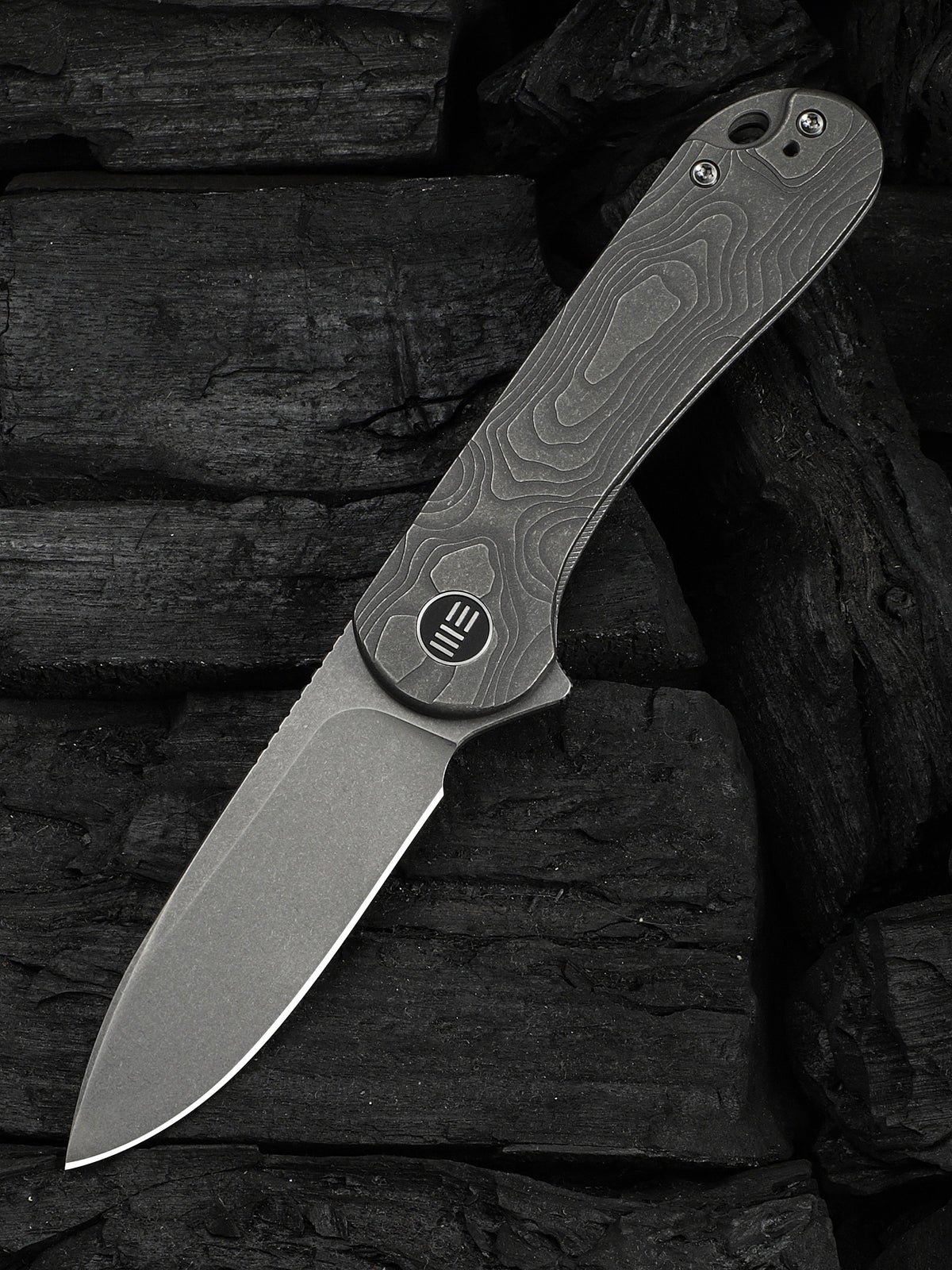 WE Elementum folding knife with gray titanium handle