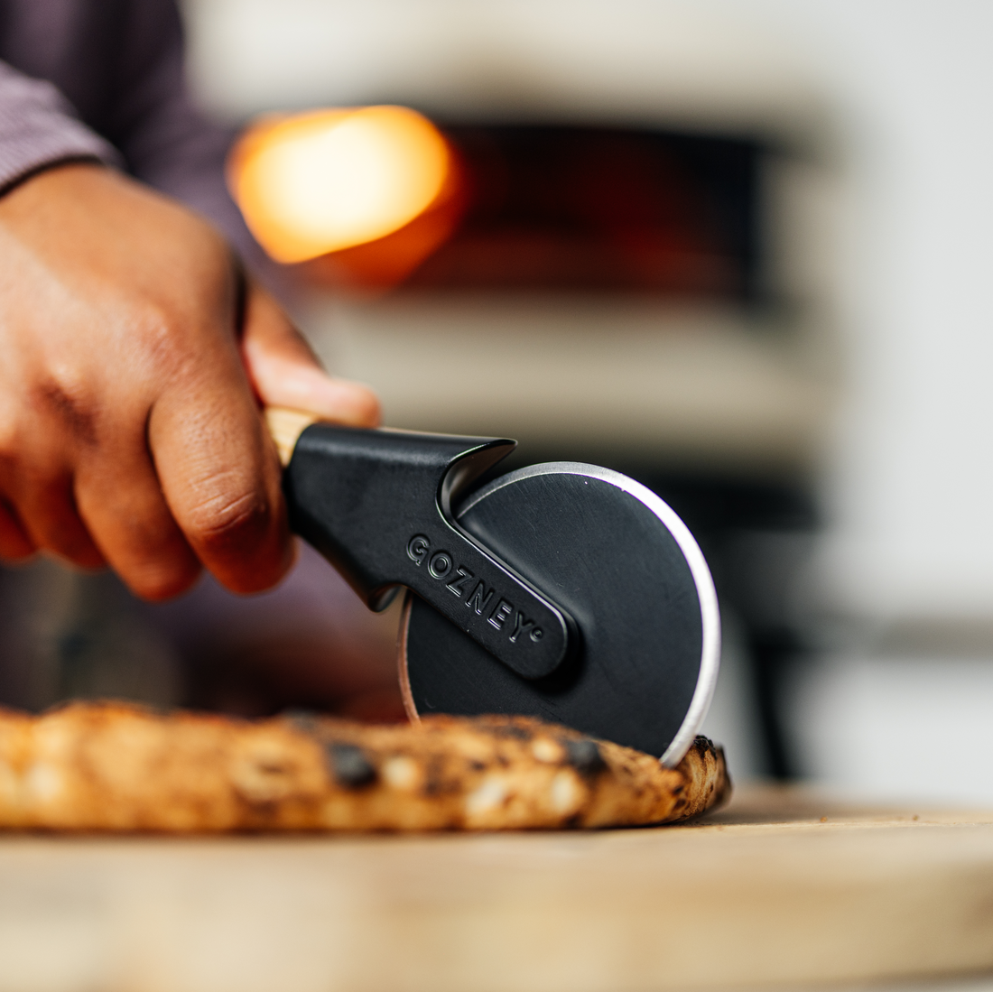 Gozney Pizza Cutter in use